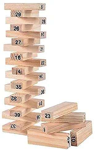 Drveni blok postavlja se na vrh tornja u igri Jenga.