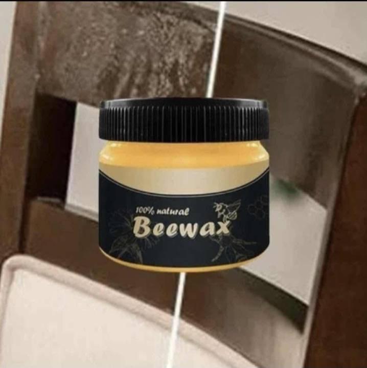 Vosak za drvo Beewax prikazan kao sredstvo za održavanje drvenih površina.