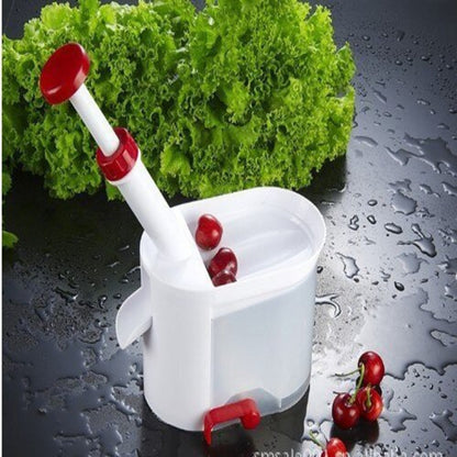 Aparat za pripremu voća bez koštica sa velikom posudom.