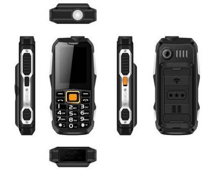 Mobilni telefon Defender sa fizičkom tastaturom i ekranom.