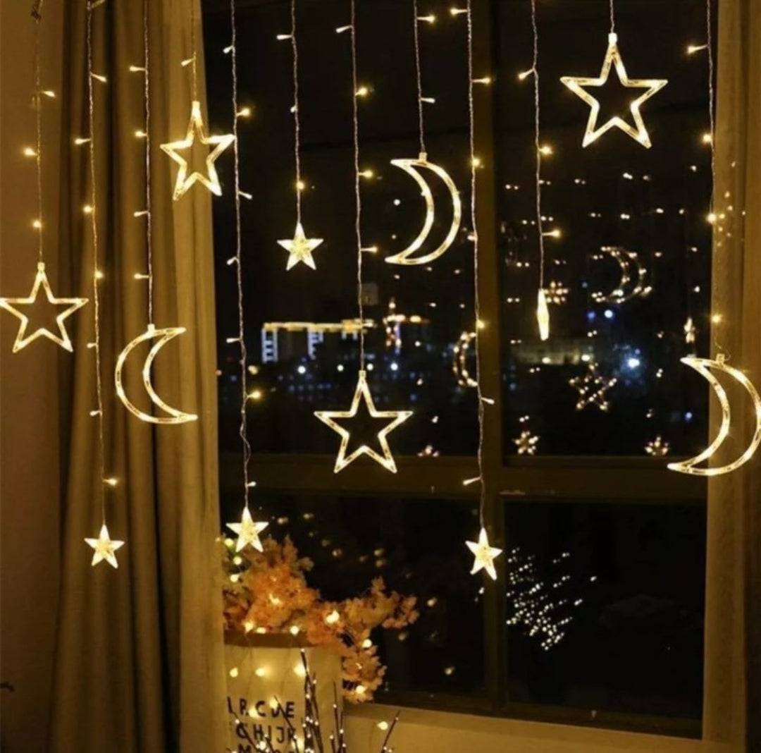 LED dekoracija sa svetlećim motivom meseca i zvezdica.