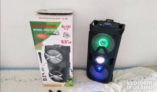Crni Bluetooth zvučnik sa LED svetlom i disko kuglom u sredini.