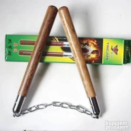 Na slici su prikazane drvene nunčake brenda PRODAVANI.