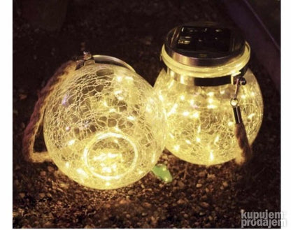 Set prikazuje dve staklene tegle sa solarnim lampama.