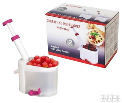Presa sa mehanizmom koji usmerava koštice u donji deo aparata.
